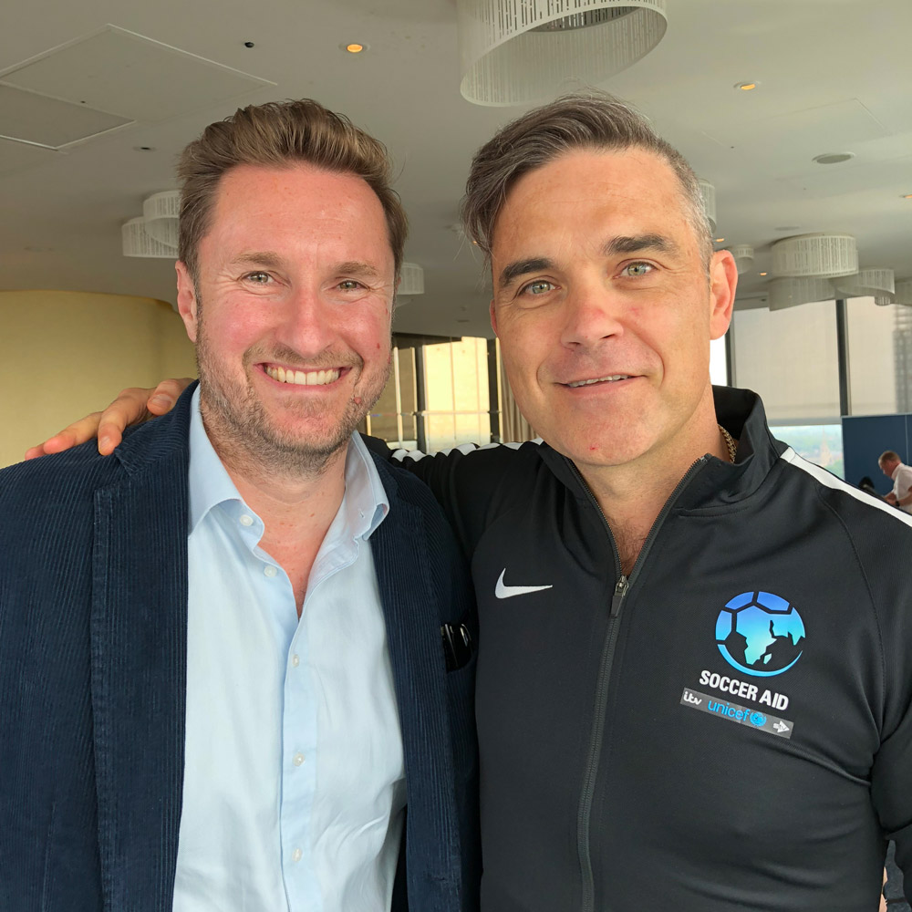 ROX Managing Director Kyron Keogh with Robbie Williams Soccer Aid