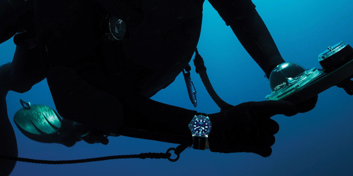 diver wearing tudor watch